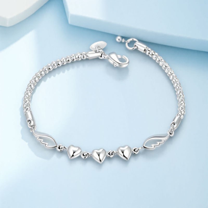 Stylish Silver-Plated Minimalist Heart-and-Feather Bracelet For Women.